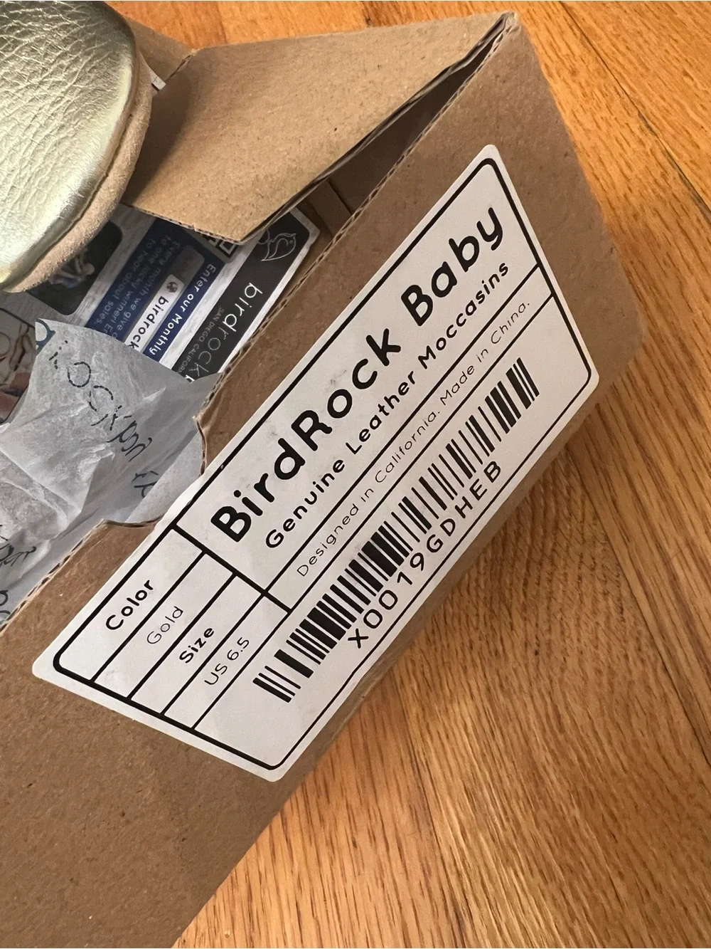 BirdRock Baby genuine leather moccasins feature a shiny gold shoes
